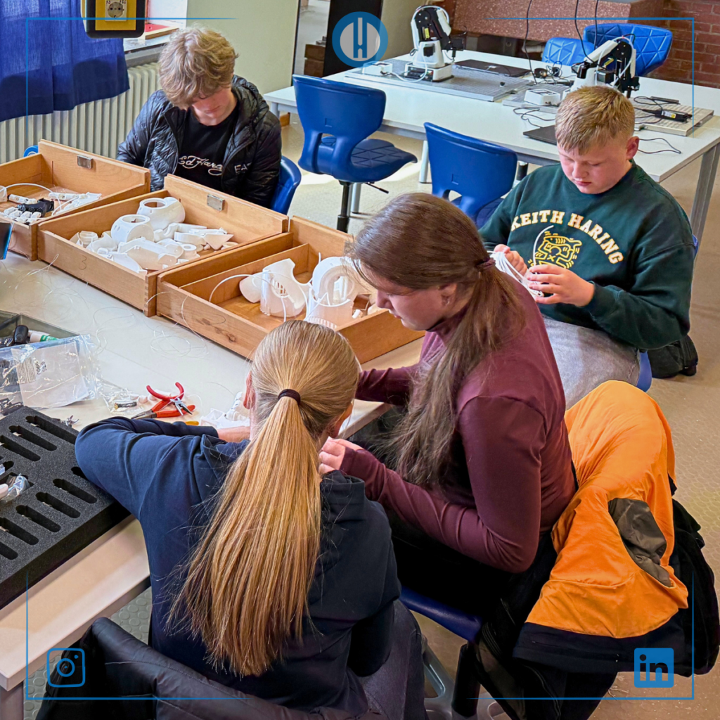 Students collaborate on a project, using tools and materials in a hands-on learning environment.