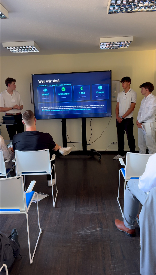 Participants presenting innovative AI-powered nano-devices for stroke prevention at the MIG event.